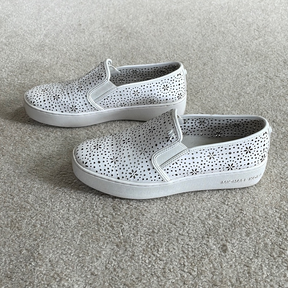 White slips on  worn but  in good condition